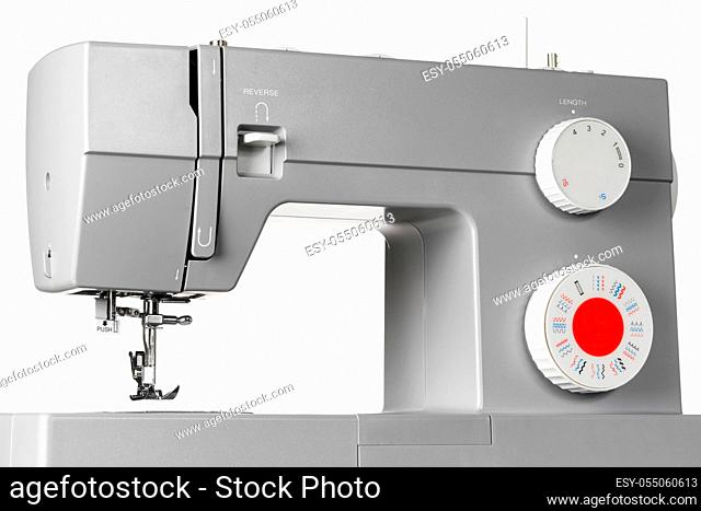Modern electric sewing machine isolated on white background