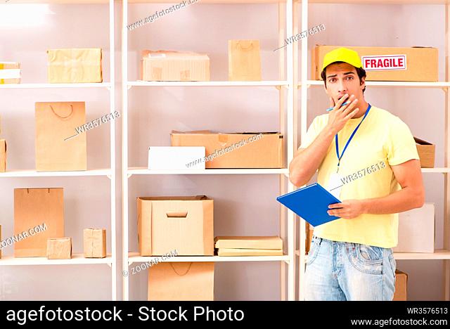 Handsome contractor working in box delivery relocation service