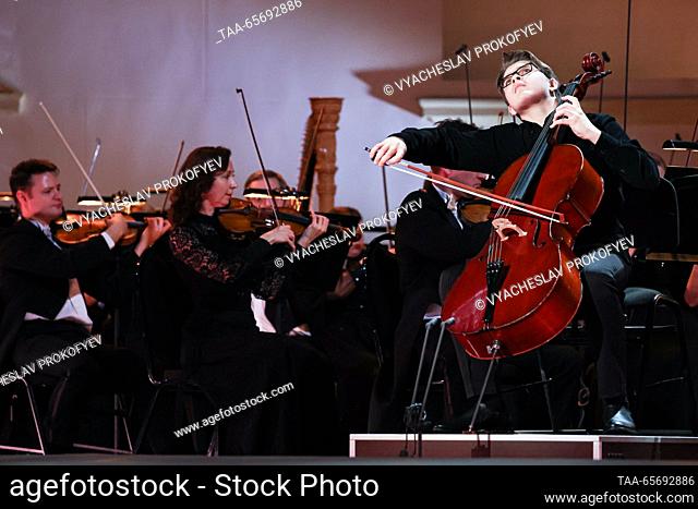 RUSSIA, MOSCOW - DECEMBER 12, 2023: The first place winner in the string category, cellist Mikhail Vasilyev, performs during an award ceremony for the 24th...
