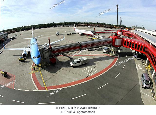 Airplane at boarding bridge at Tegel airport, Berlin, Germany, Europe