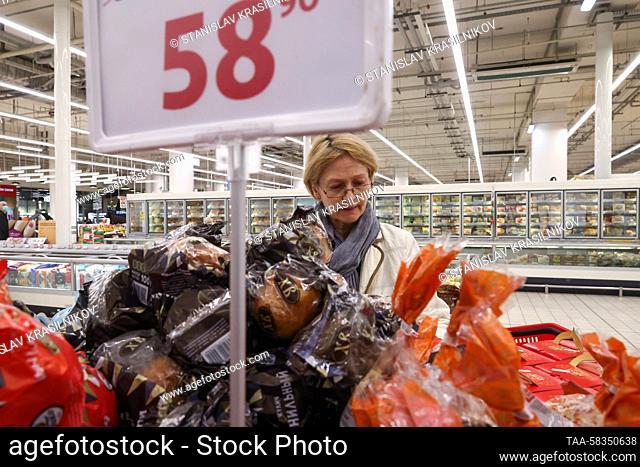 RUSSIA, MOSCOW - APRIL 11, 2023: A woman shops for Easter cakes in an Auchan superstore at the Aviapark Shopping Centre in the run-up to Orthodox Easter