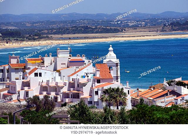 view for the old town of Lagos city with tower of Santo Antonio church, in far background long Meia Praia, Algarve, Portugal, Europe