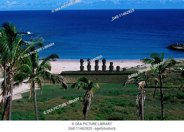 Chile, Easter Island. Rapa-Nui National Park (UNESCO World Heritage Site, 1995). Anakena beach. In the background, a row of Moais (megalithic anthropomorphic...