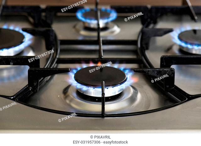 flames burning on a gas stove in the kitchen
