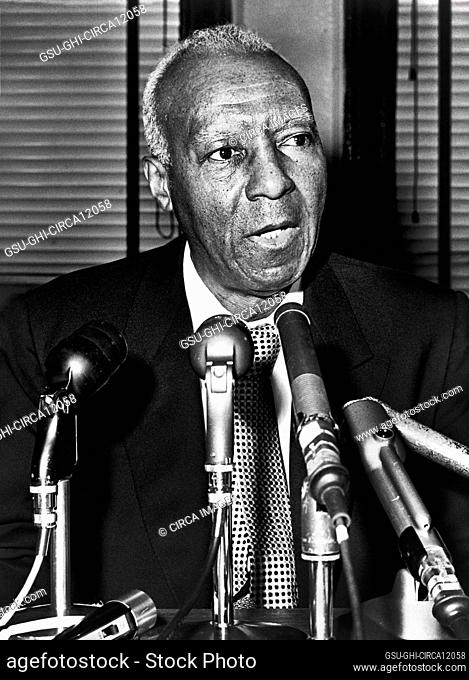 A. Philip Randolph (1889-1979), American labor unionist and civil rights activist, head and shoulders portrait at microphones during press conference, Ed Ford