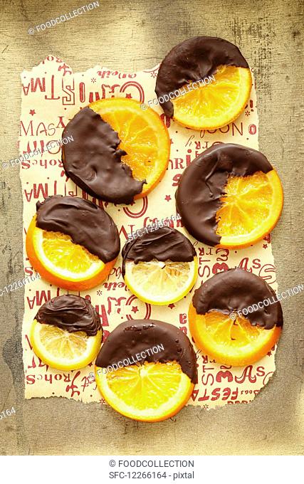 Candied orange and lemon slices with dark chocolate glazing