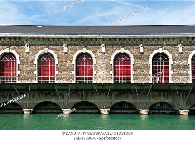 Famous Batiment des Forces-Motrices, BFM, Rhone river, historic former hydroelectric power plant, presently second Opera House in Geneva, Switzerland, Europe