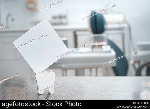 Blank card with dental office in the background