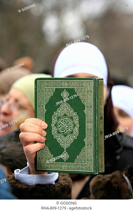 Koran being held during a Muslim demonstration, Paris, France, Europe