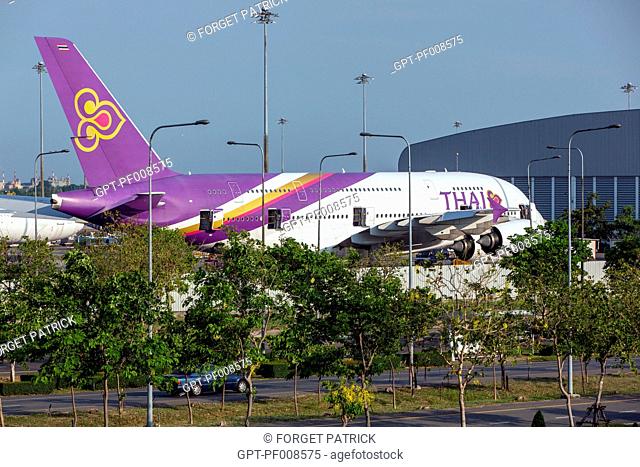 THAI AIRLINES PLANE, WHITE AND VIOLET, ON THE TARMAC AT THE AIRPORT, BANGKOK, THAILAND