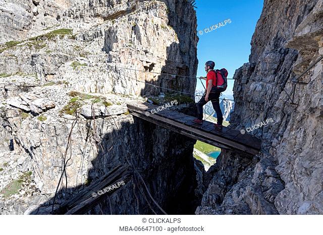 Sesto/Sexten, Dolomites, South Tyrol, province of Bolzano, Italy. Climber on the via ferrata Path of Peace to the mountain of Monte Paterno