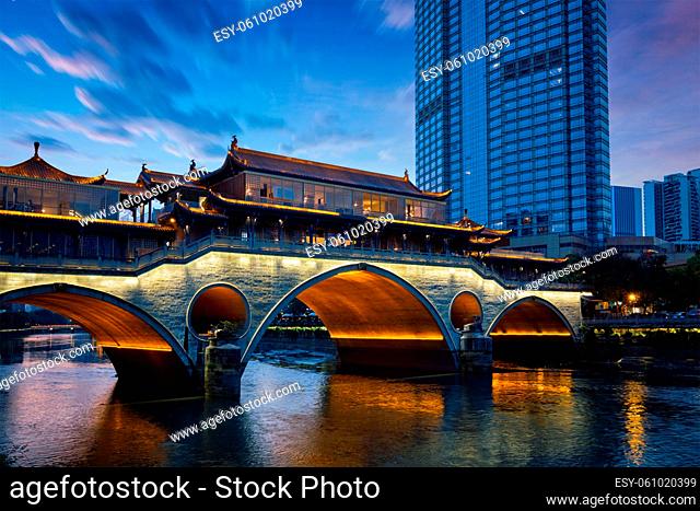 Famous landmark of Chengdu - Anshun bridge over Jin River illuminated at night, Chengdue, Sichuan , China