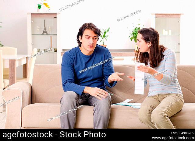 Young couple in budget planning concept