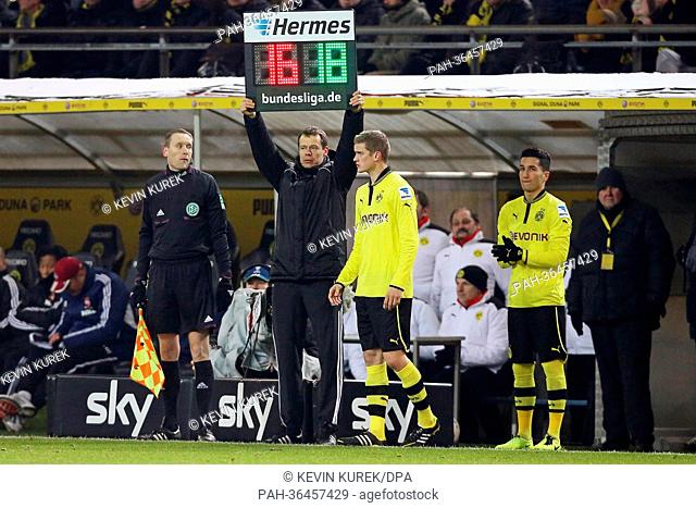 Dortmund's Sven Bender (L) uand Nuri Sahin waits at the sidelines for their substitution during the Bundesliga soccer match between Borussia Dortmund and FC...