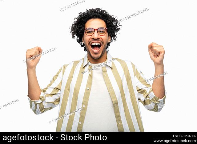 happy man in glasses celebrating victory