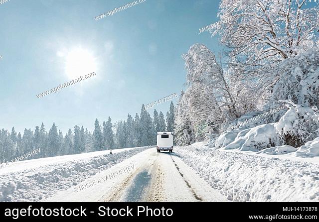 Camper on a snowy road in the mountains