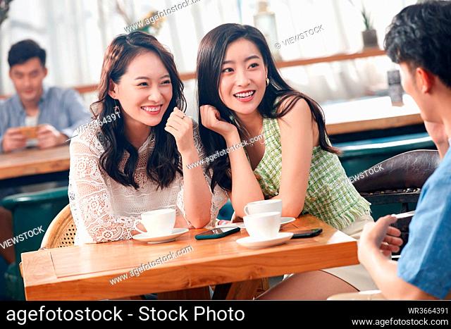 Young friends in a cafe to chat