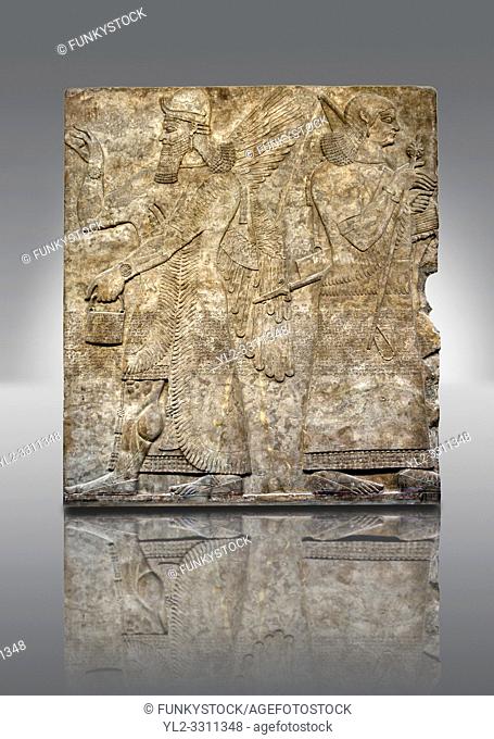 Assyrian relief sculpture panel of a female protective spirits from Nimrud, Iraq. 865-860 B. C North West Palace. British Museum Assyrian Archaeological exhibit