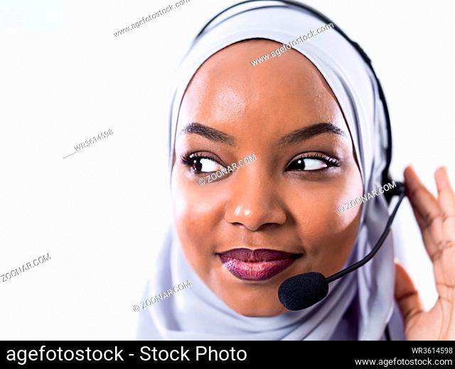 African muslim female with hijab scarf customer representative business woman with phone headset helping and supporting online with customer in modern bright...
