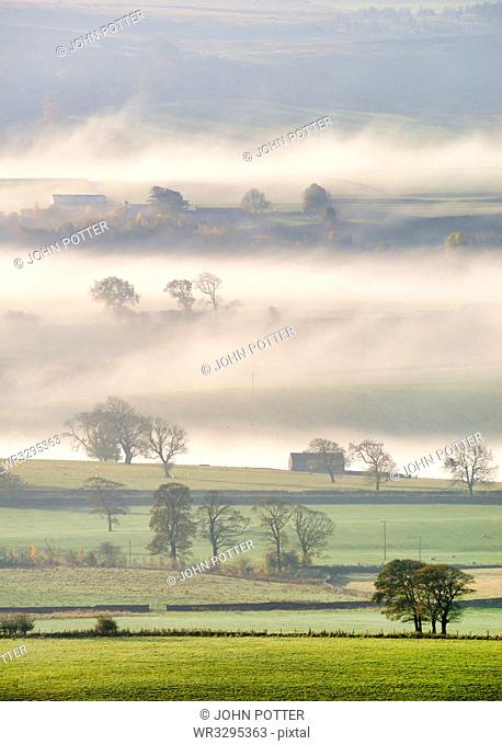 Mist rising over East Halton and Embsay in Lower Wharfedale, North Yorkshire, Yorkshire, England, United Kingdom, Europe