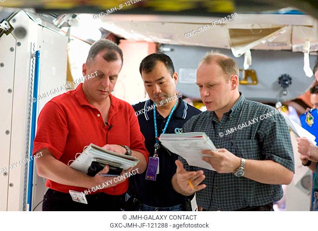 Cosmonaut Oleg Kotov (right), Expedition 22 flight engineer and Expedition 23 commander; along with Japan Aerospace Exploration Agency (JAXA) astronaut Soichi...