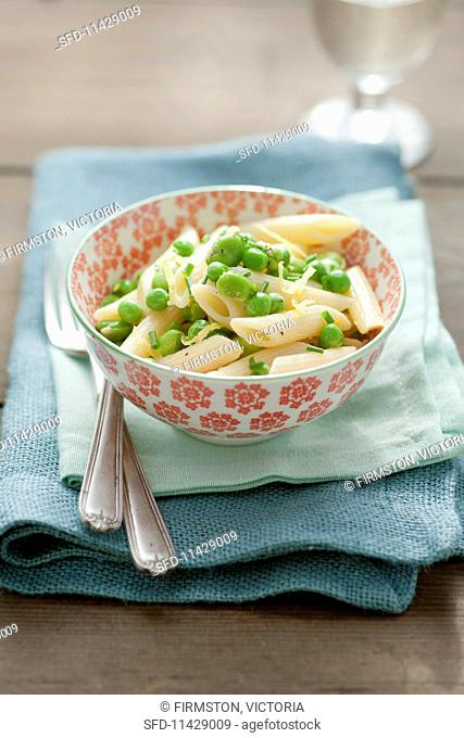 Penne pasta with broad beans and peas