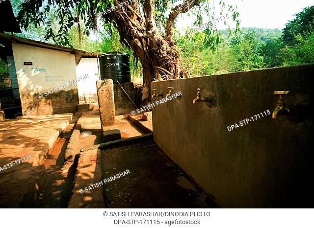 Village school and water tap at Rajwadi , Sangmeshwar , Ratnagiri , Maharashtra , India