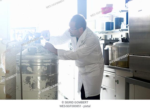 Chemist controlling nitrogen concentration in a laboratory