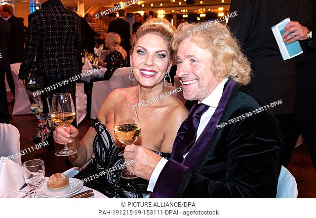 15 December 2019, Baden-Wuerttemberg, Baden-Baden: Thomas Gottschalk and his girlfriend Karina Mross are sitting at a table in the Kurhaus before being voted...