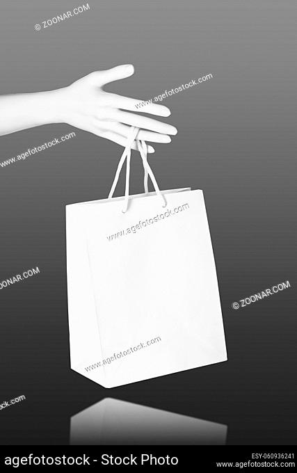 Mannequin Hand with blank shopping bag. Mock up. Sale shopping concept