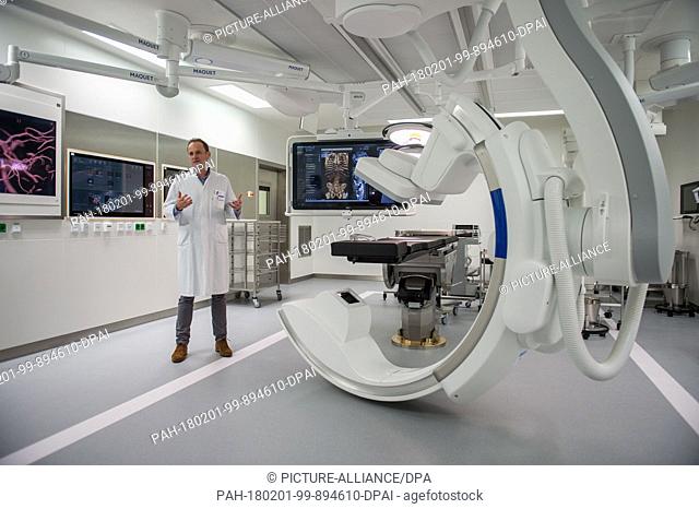 Juergen Gschwend, director of the clinic for urology, stands in a new surgery room next to an angiographic C-arm system during the inaugural press conference at...