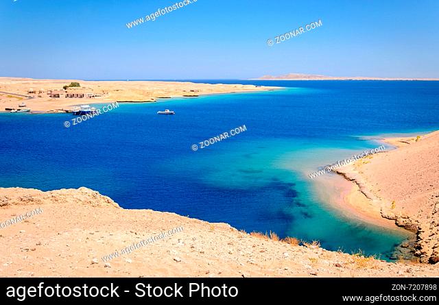 In the picture a beautiful turquoise lagoon with rocky beaches located in Egypt in the Red Sea