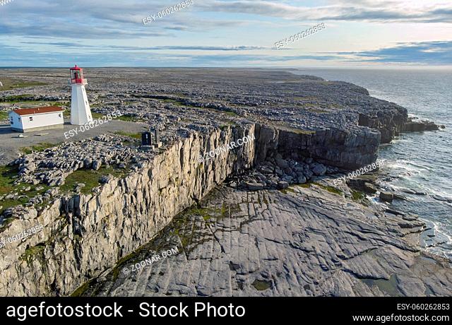The Cape Norman Lighthouse sits on rocky cliffs near Cook's Harbour, Newfoundland