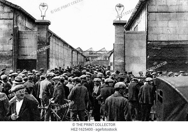 Workers at the entrance of a Billancourt factory, Paris, 1931. Illustration from the book Paris published by Ernest Flammarion, (1931)