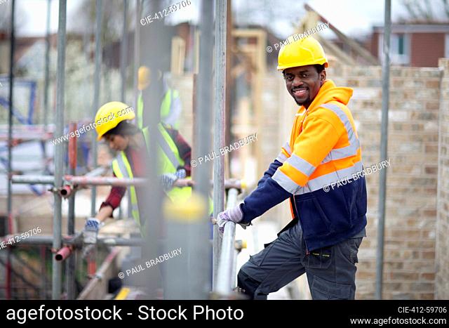 Portrait confident male construction worker at construction site