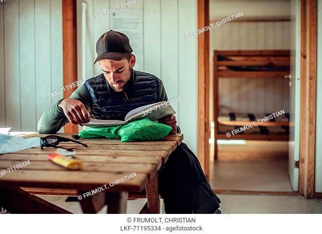 Hiker in a cabin, greenland, arctic