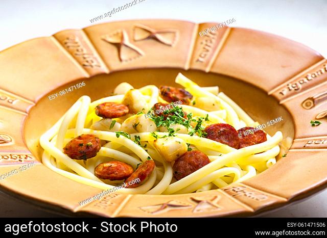 macaroni with sausage and chopped parsley