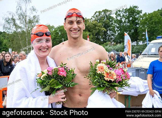 01 July 2023, Mecklenburg-Western Pomerania, Stralsund: The winners of the 58th International Sund Swim, Tina Kehlitz in the women's race and Tom Maron in the...