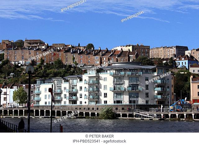 England Bristol Bristol's Floating Harbour showing modern harbourside dwellings and above older houses blending together