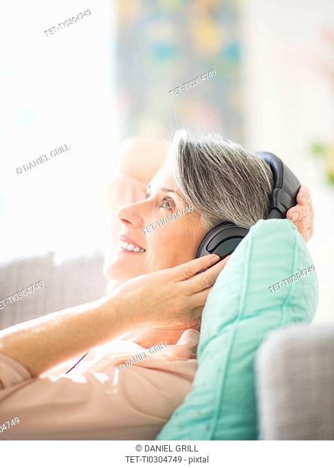 Portrait of woman listening to music