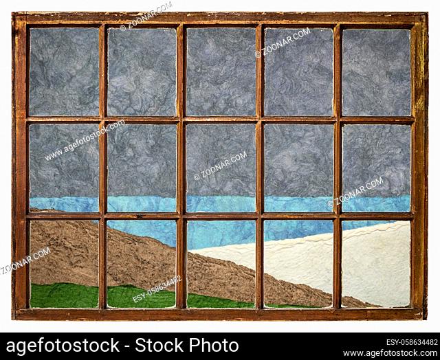 abstract lake and valley landscape created with handmade sheets of rough paper as seen through a vintage sash window
