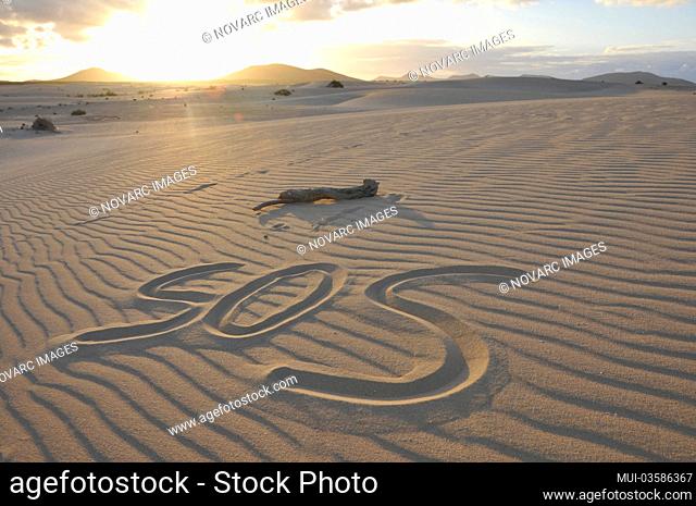 SOS written in the sand, dune, in the evening, Corralejo National Park, Fuerteventura, Canary Islands, Spain, Europe