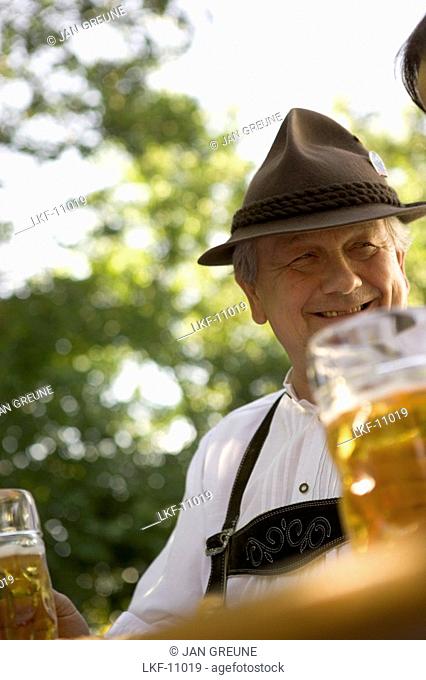 Senior man in beergarden near Lake Starnberg, Bavaria, Germany