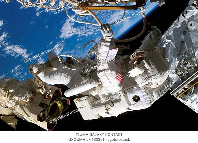 Astronaut Rex J. Walheim, STS-110 mission specialist, anchored to the mobile foot restraint at the end of the International Space Station's (ISS) Canadarm2