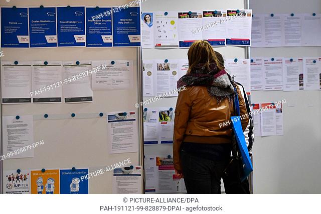 21 November 2019, Thuringia, Erfurt: Job offers hang on a job wall at the Thuringian company contact fair academix. Only Thuringian companies presented their...