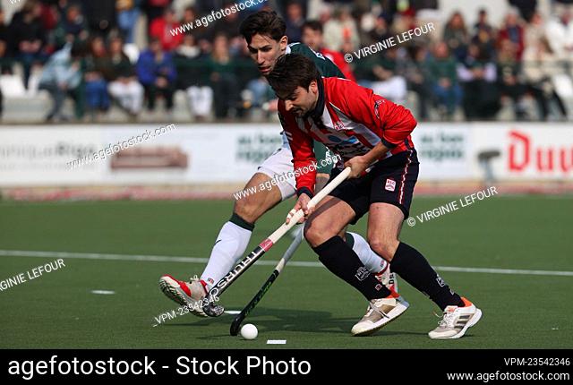 Watducks' Emile Esquelin and Leopold's Corentin De Trez fight for the ball during a hockey game between Royal Leopold Club and Waterloo Ducks