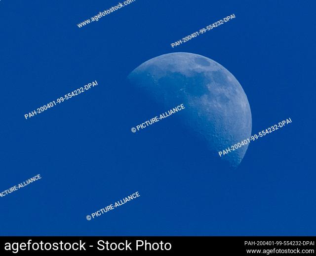 01 April 2020, Saxony, Dresden: The waxing crescent can be seen in the sky above Dresen. Photo: Robert Michael/dpa-Zentralbild/ZB