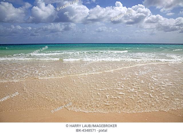 Sandy beach, surf and turquoise sea with clouds, Playa Bajo Negro, Corralejo Natural Park, Fuerteventura, Canary Islands, Spain