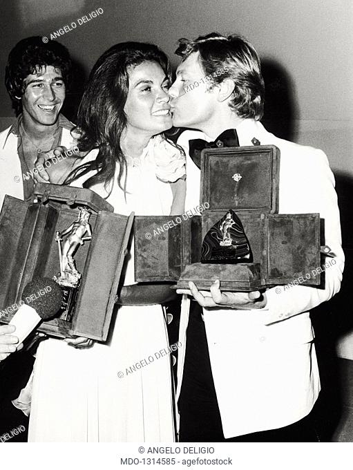 Helmut Berger, Florinda Bolkan and Ryan O'Neal at the David di Donatello Awards. Austrian actor Helmut Berger kissing the David di Donatello-winning Brazilian...