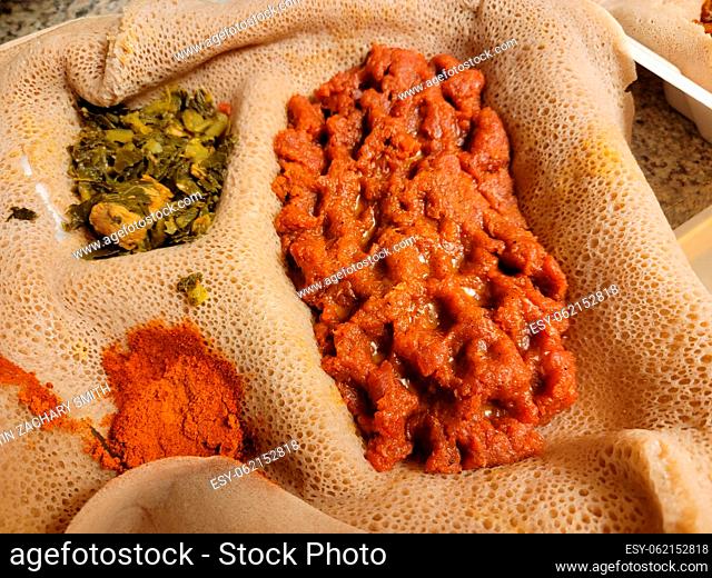 Ethiopian food savory and delicious kitfo raw beef with injera bread